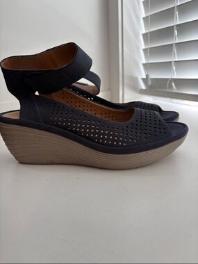 Clarks Black Perforated Wedge Sandals with Tan Platform